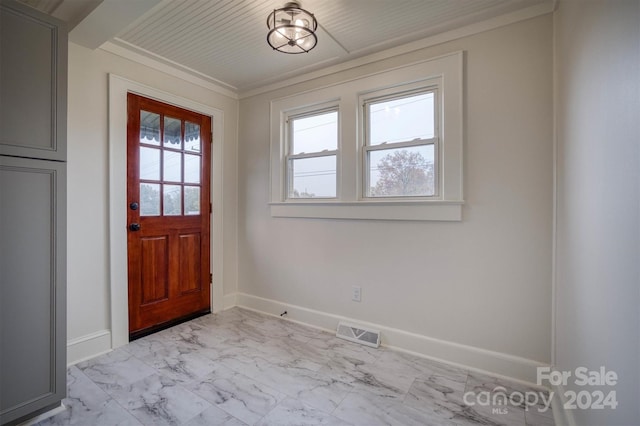 doorway featuring ornamental molding