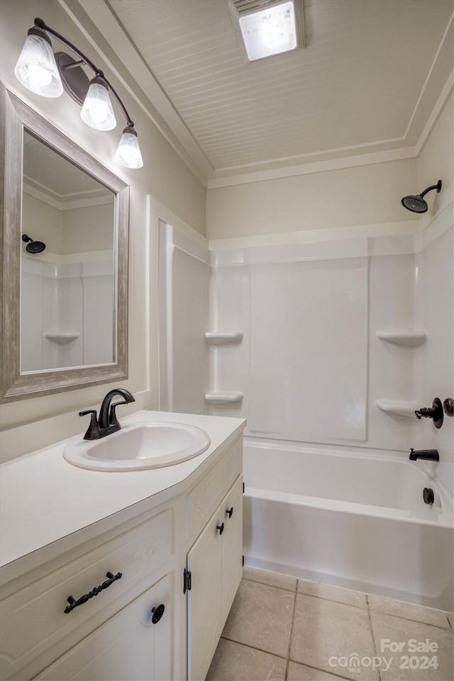 bathroom with bathing tub / shower combination, vanity, and tile patterned flooring