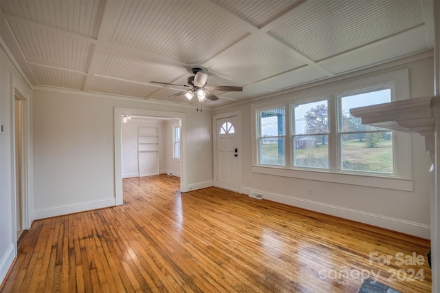 interior space featuring ornamental molding, light hardwood / wood-style flooring, ceiling fan, and coffered ceiling