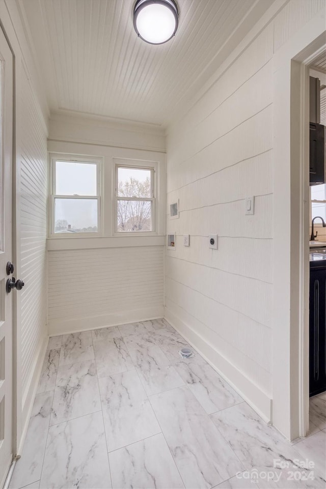 laundry room featuring wooden ceiling, wood walls, hookup for an electric dryer, and ornamental molding