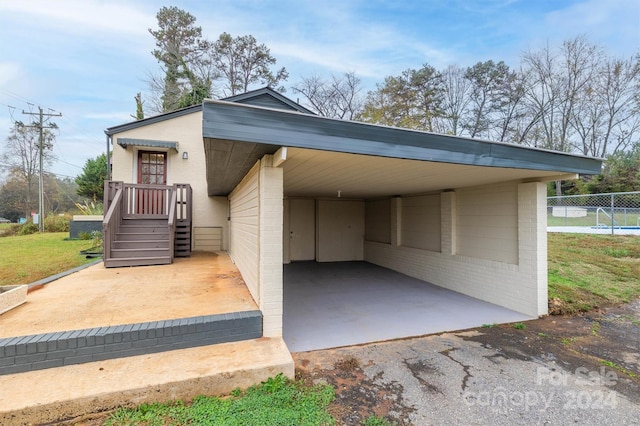 view of parking featuring a carport