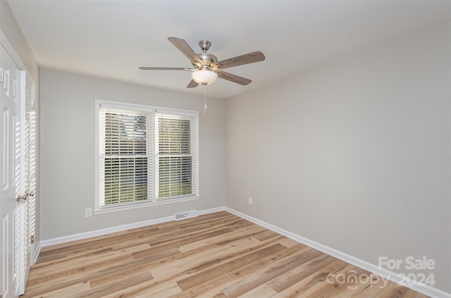 unfurnished room featuring ceiling fan and light hardwood / wood-style flooring