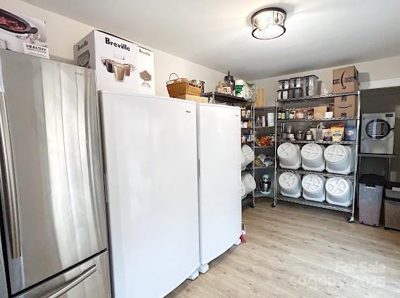 storage area with washer / clothes dryer