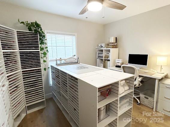 office space with wood-type flooring