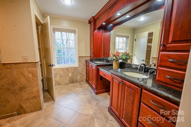 bathroom featuring plenty of natural light, tile walls, and crown molding