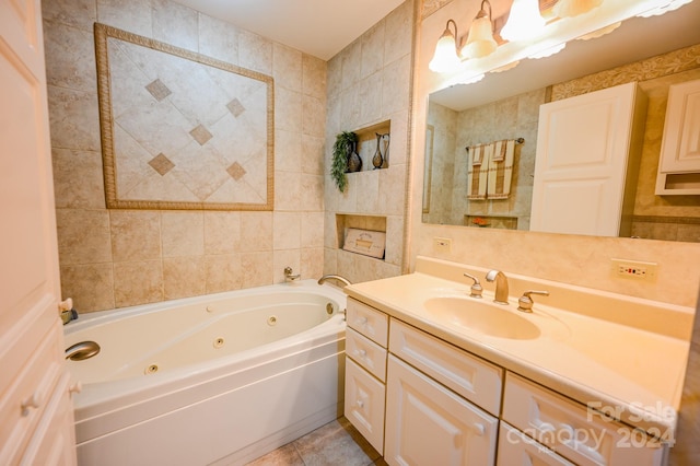 bathroom featuring vanity, tile patterned floors, a bathtub, and tile walls