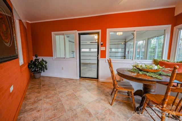 dining area featuring crown molding