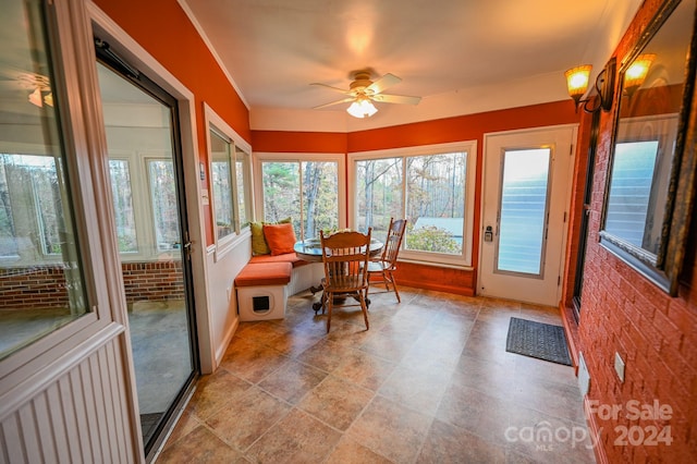 sunroom / solarium with ceiling fan