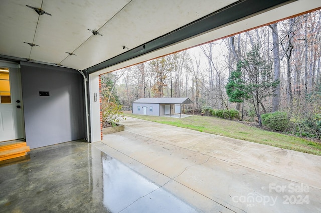 garage featuring a lawn