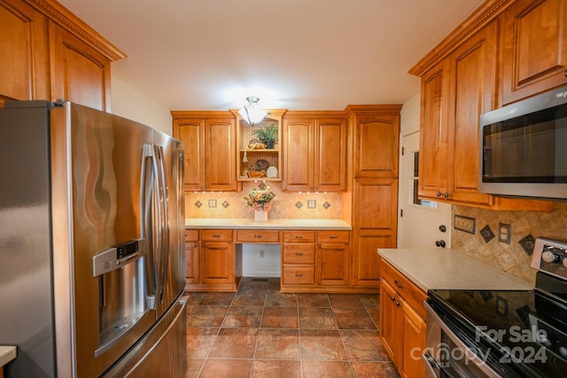 kitchen with backsplash and stainless steel appliances