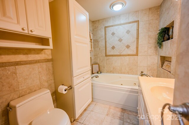 183 Creekside Dr, Forest City, NC 28043 - full bathroom with tile walls, a tub with jets, toilet, tile patterned flooring, and vanity