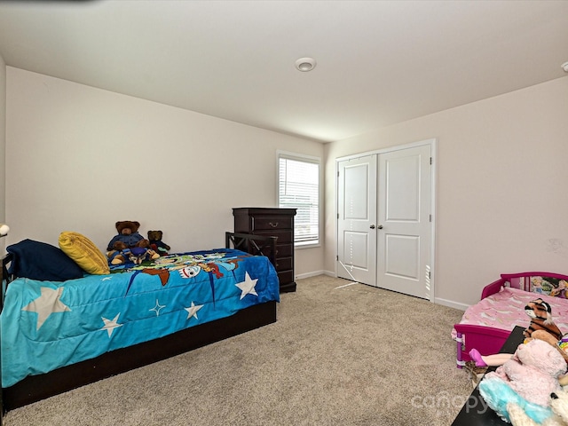 bedroom with carpet floors and a closet