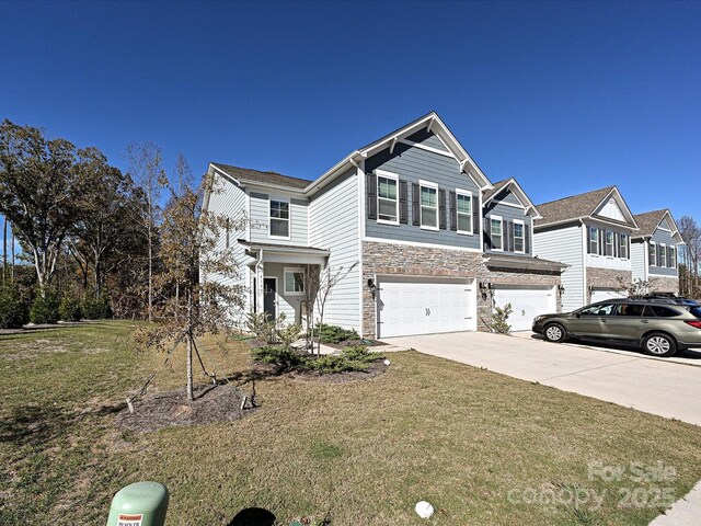 view of front of house featuring a front lawn and a garage