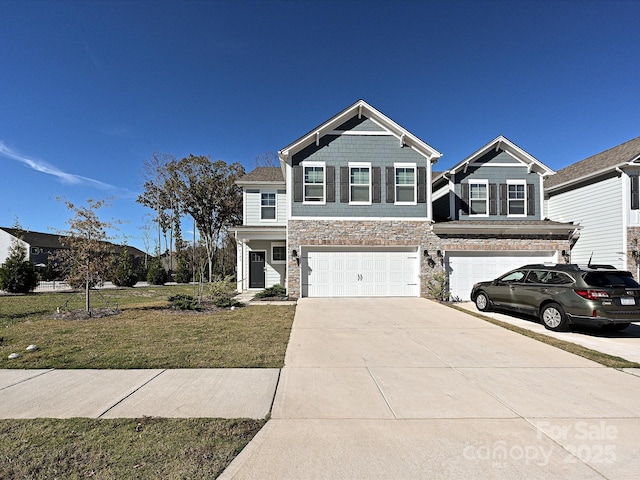 view of front of house featuring a garage and a front yard