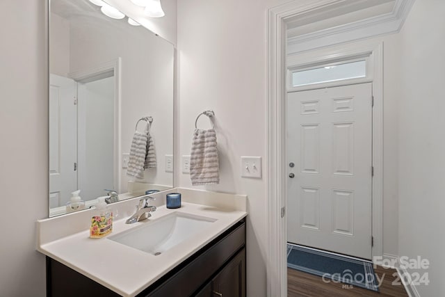 bathroom with vanity and hardwood / wood-style flooring