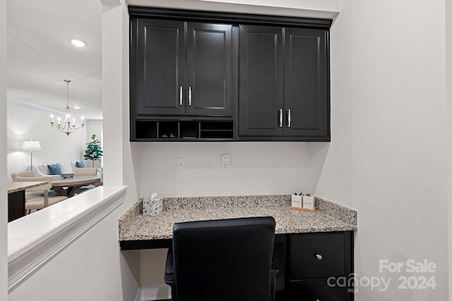 office with crown molding and a chandelier