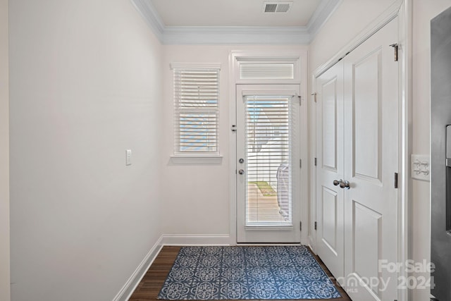 entryway featuring dark hardwood / wood-style floors and crown molding