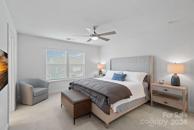 carpeted bedroom with ceiling fan