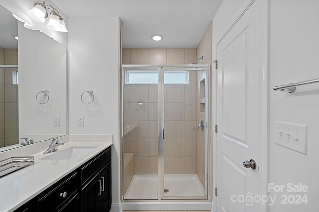 bathroom with vanity and an enclosed shower