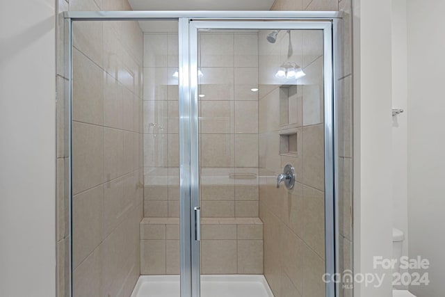 bathroom with an enclosed shower