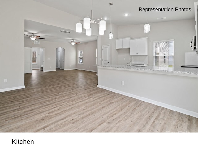 204 Lake George Dr, Shelby, NC 28152 - kitchen with a ceiling fan, white cabinets, light wood finished floors, hanging light fixtures, and recessed lighting