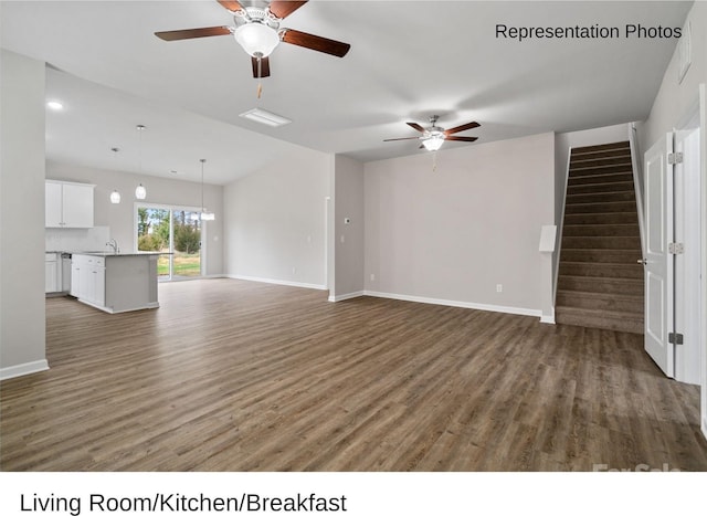 204 Lake George Dr, Shelby, NC 28152 - unfurnished living room featuring ceiling fan, wood finished floors, a sink, baseboards, and stairway