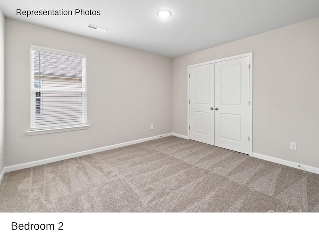 204 Lake George Dr, Shelby, NC 28152 - unfurnished bedroom featuring carpet, baseboards, and a closet