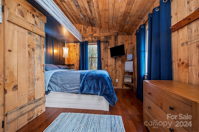 bedroom with dark hardwood / wood-style flooring, vaulted ceiling, wooden ceiling, and wood walls