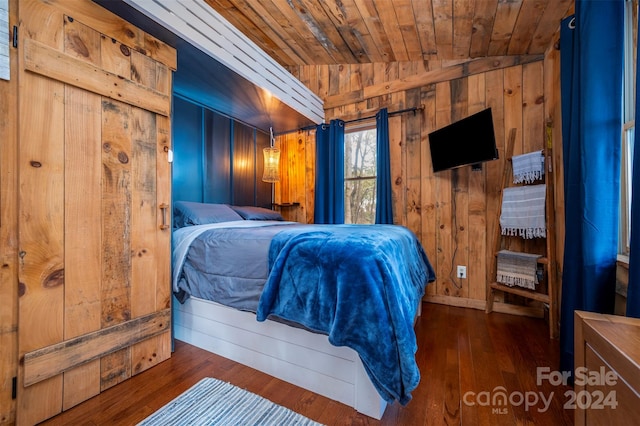 bedroom featuring dark wood-type flooring, wooden ceiling, and lofted ceiling