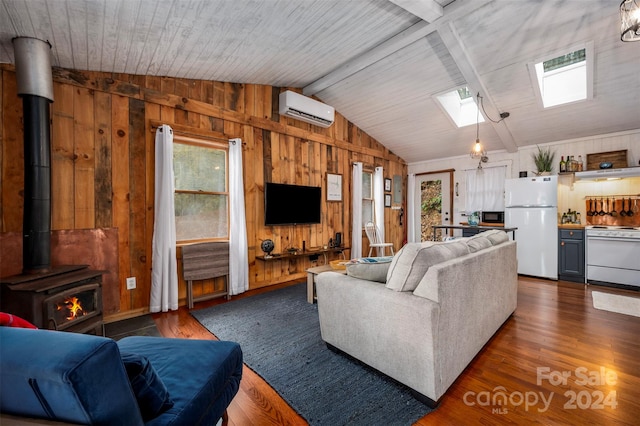 living room with a wall mounted air conditioner, a wood stove, a healthy amount of sunlight, and wood walls