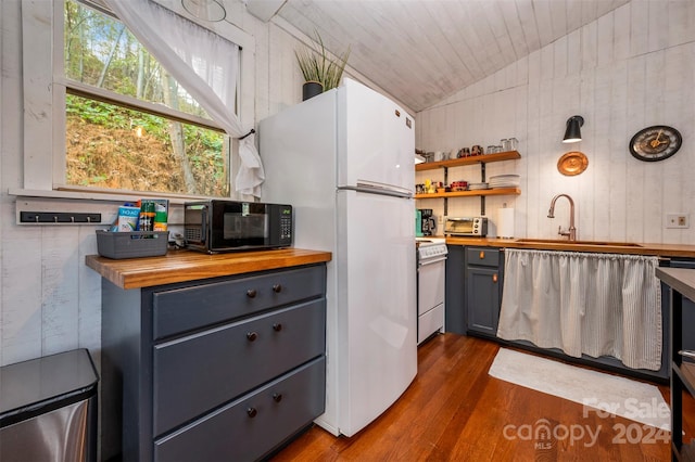 kitchen featuring wooden ceiling, wood counters, dark hardwood / wood-style flooring, white appliances, and vaulted ceiling