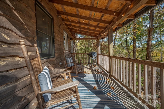 wooden terrace featuring area for grilling