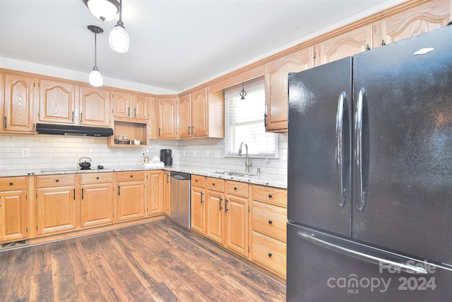 kitchen with dark hardwood / wood-style flooring, light stone counters, hanging light fixtures, and black appliances