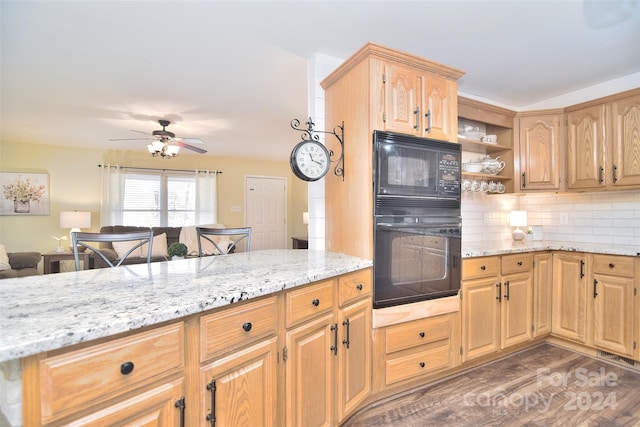 kitchen with backsplash, black appliances, dark hardwood / wood-style floors, ceiling fan, and light stone countertops