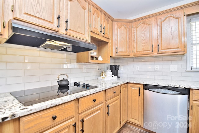 kitchen featuring dishwasher, light stone countertops, black electric cooktop, and backsplash