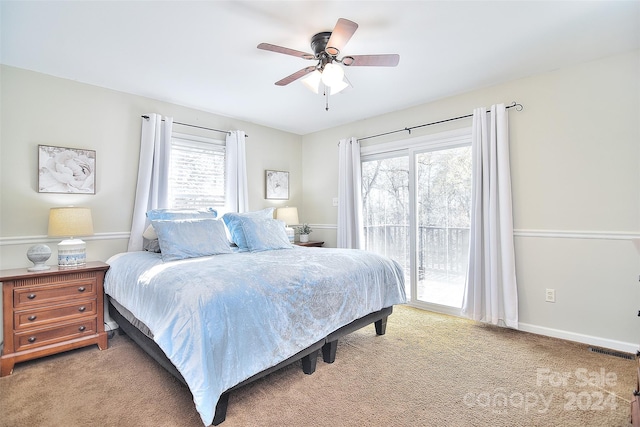 carpeted bedroom with access to outside and ceiling fan