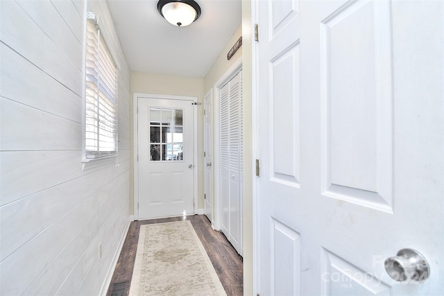 doorway featuring dark wood-type flooring