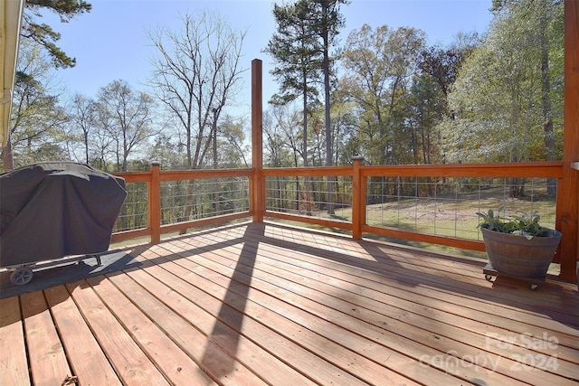 wooden terrace featuring area for grilling