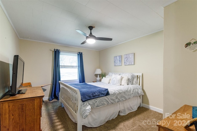 bedroom with dark colored carpet, ceiling fan, and ornamental molding