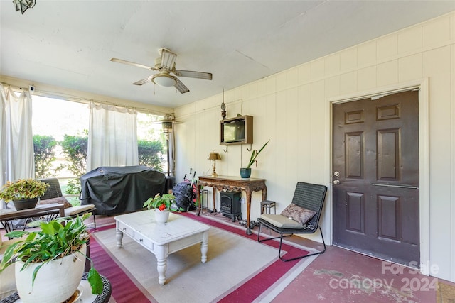 interior space with ceiling fan