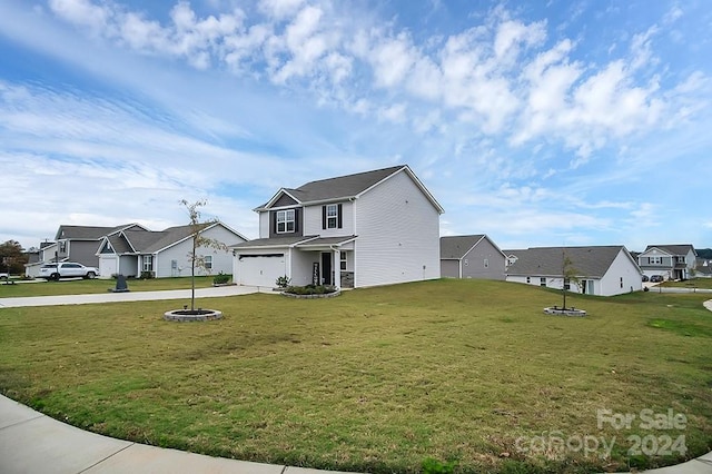 exterior space with a garage and a front yard