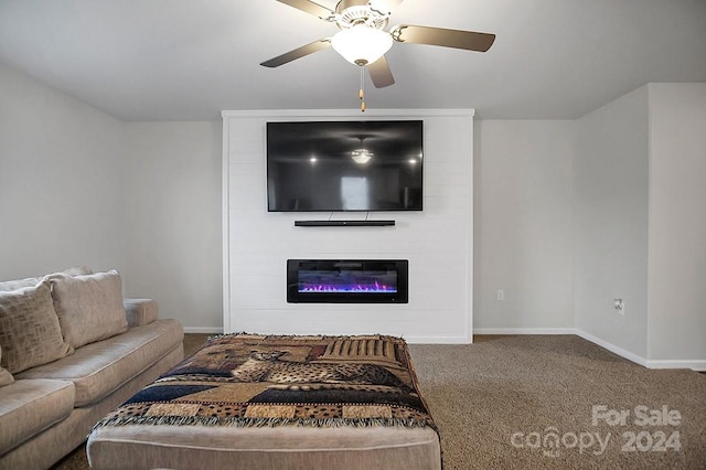 carpeted living room featuring a fireplace and ceiling fan