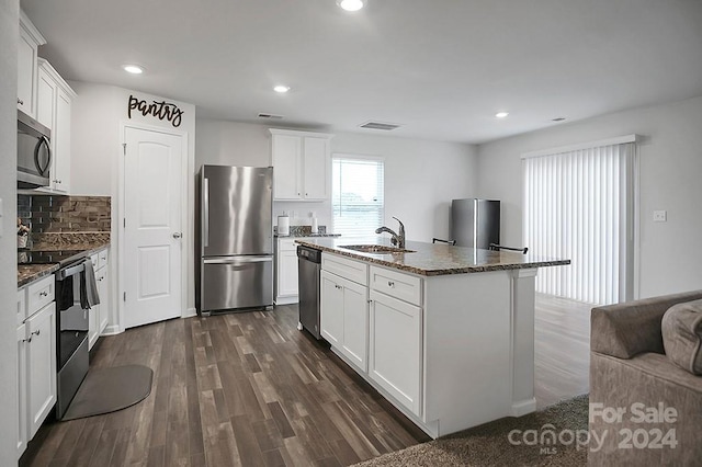 kitchen with white cabinets, stainless steel appliances, and sink