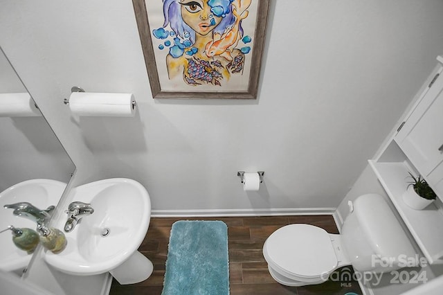 bathroom featuring toilet and hardwood / wood-style floors