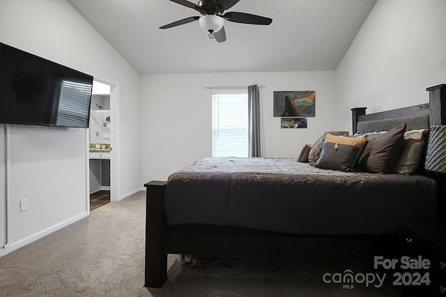 carpeted bedroom featuring ceiling fan and lofted ceiling