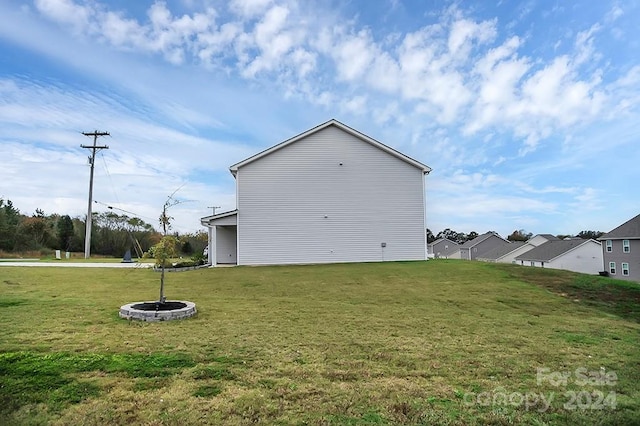 view of home's exterior with a yard