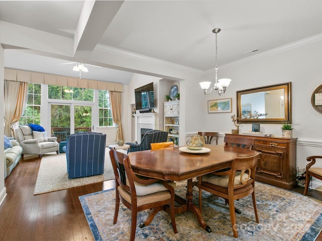 dining room with beamed ceiling, a notable chandelier, dark hardwood / wood-style flooring, and ornamental molding