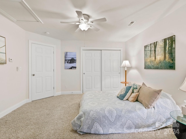 bedroom with carpet flooring, ceiling fan, and a closet