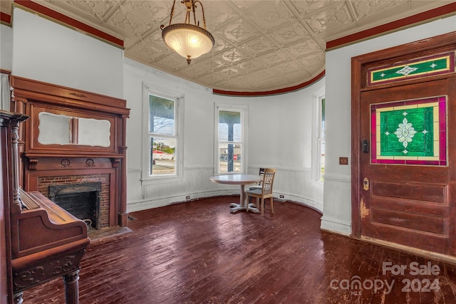 entryway featuring a fireplace and hardwood / wood-style flooring