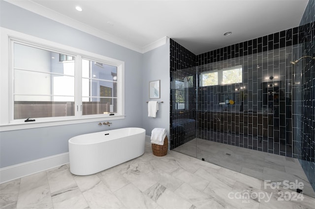 bathroom featuring ornamental molding and shower with separate bathtub